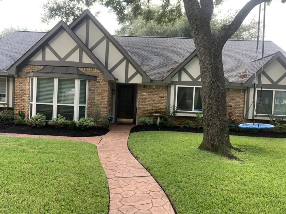 Transformed front-yard landscaping with fresh beds at a Houston home